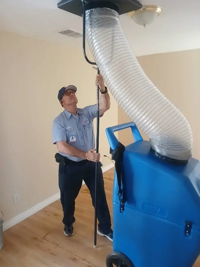Furnace Tune-Up technician using HEPA equipment in Slidell